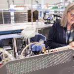 A Nextern employee works on developing a new medical device