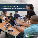Photo of employee collaboration at Nextern for 'Modern Practices Turbocharge Medical Device Software Engineering' for article